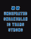 UNDEFEATED X SNEAKERLAH - 10YRS STRONG TEE - BLACK