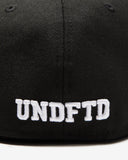 UNDEFEATED HO25 X NEW ERA ALL OVER FITTED - BLACK