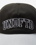 UNDEFEATED 2 TONE ARCH SNAPBACK BLACK GREY