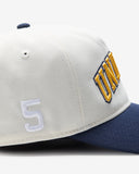 UNDEFEATED 2 TONE ARCH SNAPBACK IVORY NAVY
