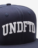 UNDEFEATED ARCH SNAPBACK DARK NAVY