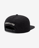 UNDEFEATED FA25 SLOUCHY 5 PANEL SNAPBACK - BLACK