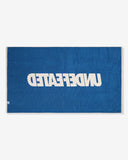 UNDEFEATED SU26 LOGO BEACH TOWEL- CREAM