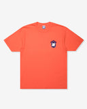 UNDEFEATED SP26 EMBLEM S/S TEE-CORAL