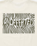 UNDEFEATED TRIP S/S TEE IVORY