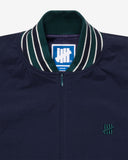 UNDEFEATED SU26 HALF ZIP WINDBREAKER - NAVY / PINE