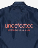 UNDEFEATED SP26 INC. COACHES JACKET - NAVY