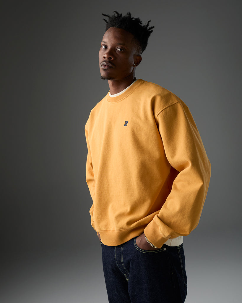 UNDEFEATED SP26 ICON CREWNECK - GOLD