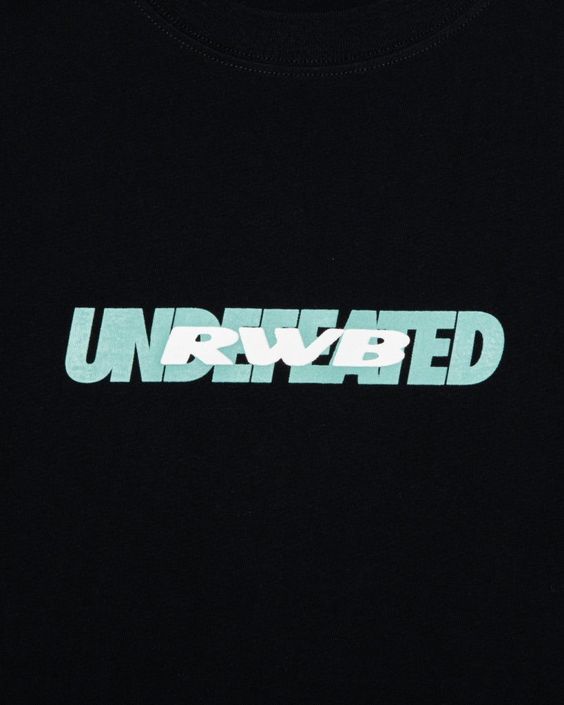 UNDEFEATED SP26 X RWB S/S TEE - TIFFANY BLACK
