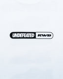 UNDEFEATED SP26 X RWB S/S TEE - WHITE