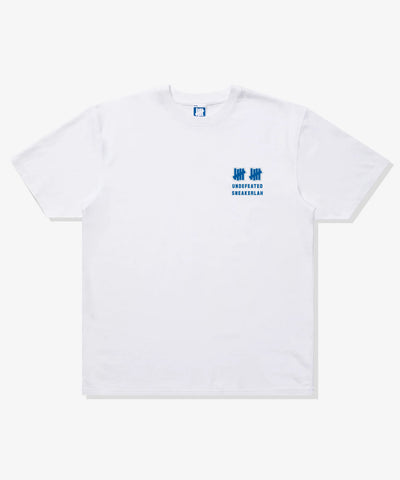 UNDEFEATED X SNEAKERLAH - 10YRS STRONG TEE - WHITE