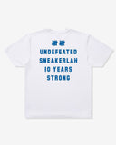 UNDEFEATED X SNEAKERLAH - 10YRS STRONG TEE - WHITE