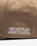 UNDEFEATED X SNEAKERLAH - PLAY DIRTY CAP - BROWN