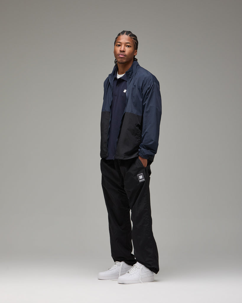 UNDEFEATED 2-TONE TRACK JACKET NAVY-BLACK