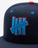 FA26 UNDEFEATED X NE ICON HAPPY FITTED - NAVY