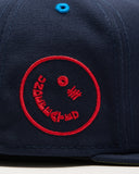 FA26 UNDEFEATED X NE ICON HAPPY FITTED - NAVY