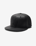 UNDEFEATED SP26 X NE LEATHER ICON FITTED - BLACK