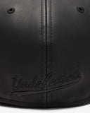 UNDEFEATED SP26 X NE LEATHER ICON FITTED - BLACK