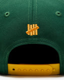 UNDEFEATED SP26 PLAY DIRTY SNAPBACK - HUNTER GREEN