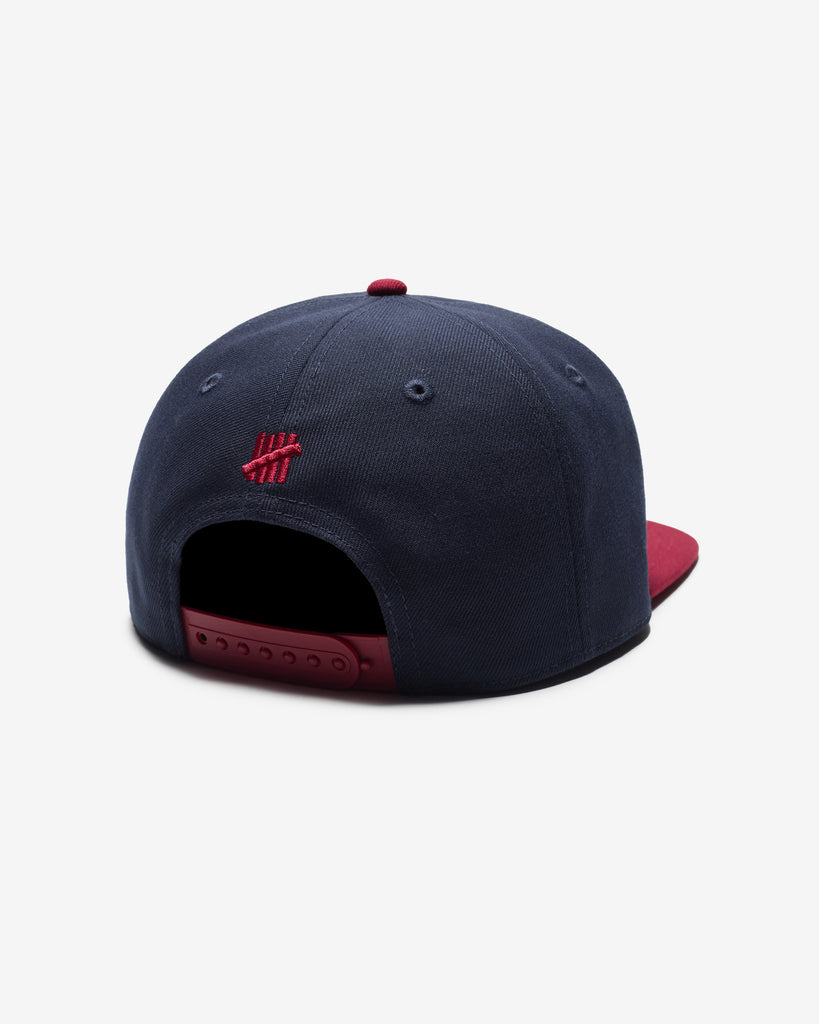 UNDEFEATED SP26 PLAY DIRTY SNAPBACK - NAVY