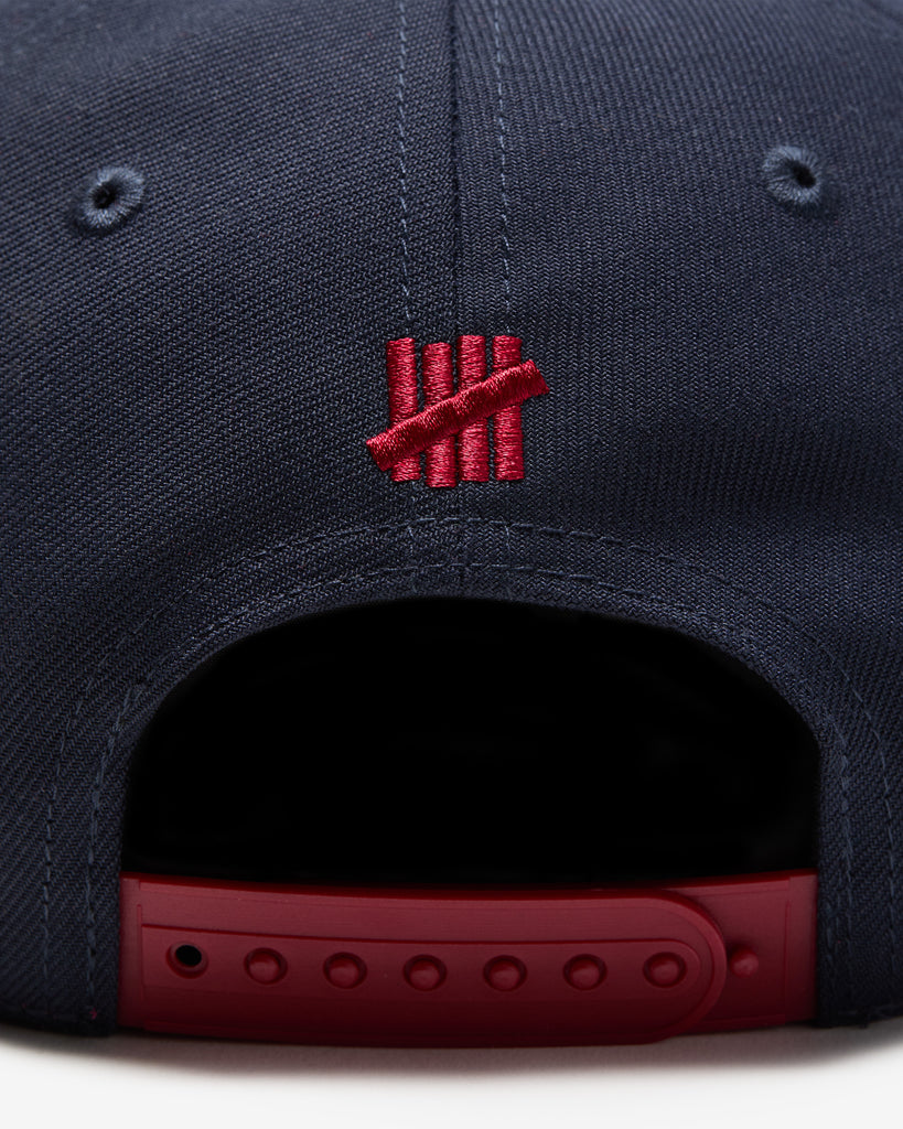 UNDEFEATED SP26 PLAY DIRTY SNAPBACK - NAVY