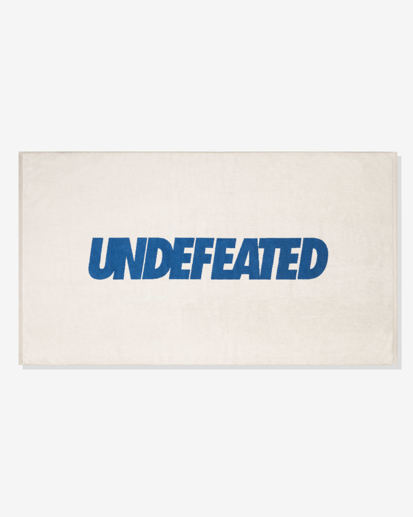 UNDEFEATED SU26 LOGO BEACH TOWEL- CREAM