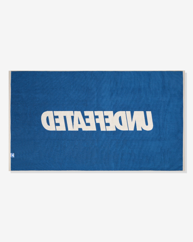 UNDEFEATED SU26 LOGO BEACH TOWEL- CREAM