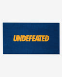 UNDEFEATED SU26 LOGO BEACH TOWEL- ROYAL BLUE