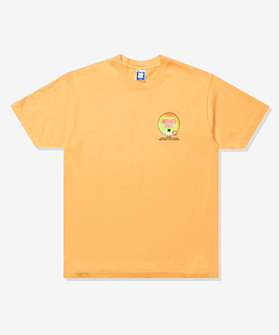 UNDEFEATED ADVERTISEMENT S/S TEE WARM-APRICOT