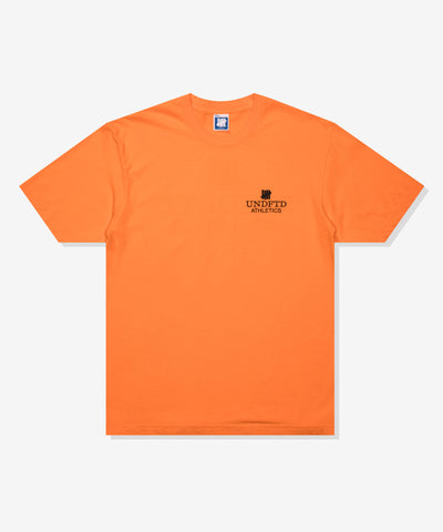 UNDEFEATED SP26 ATHLETICS S/S TEE-ORANGE