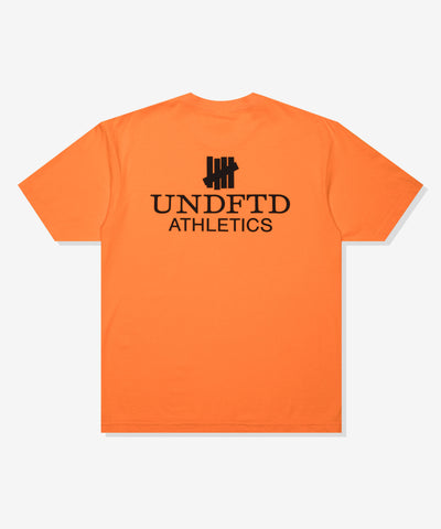 UNDEFEATED SP26 ATHLETICS S/S TEE-ORANGE