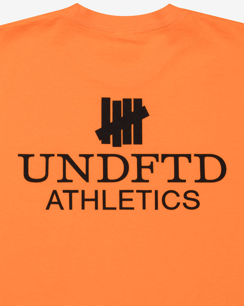 UNDEFEATED SP26 ATHLETICS S/S TEE-ORANGE