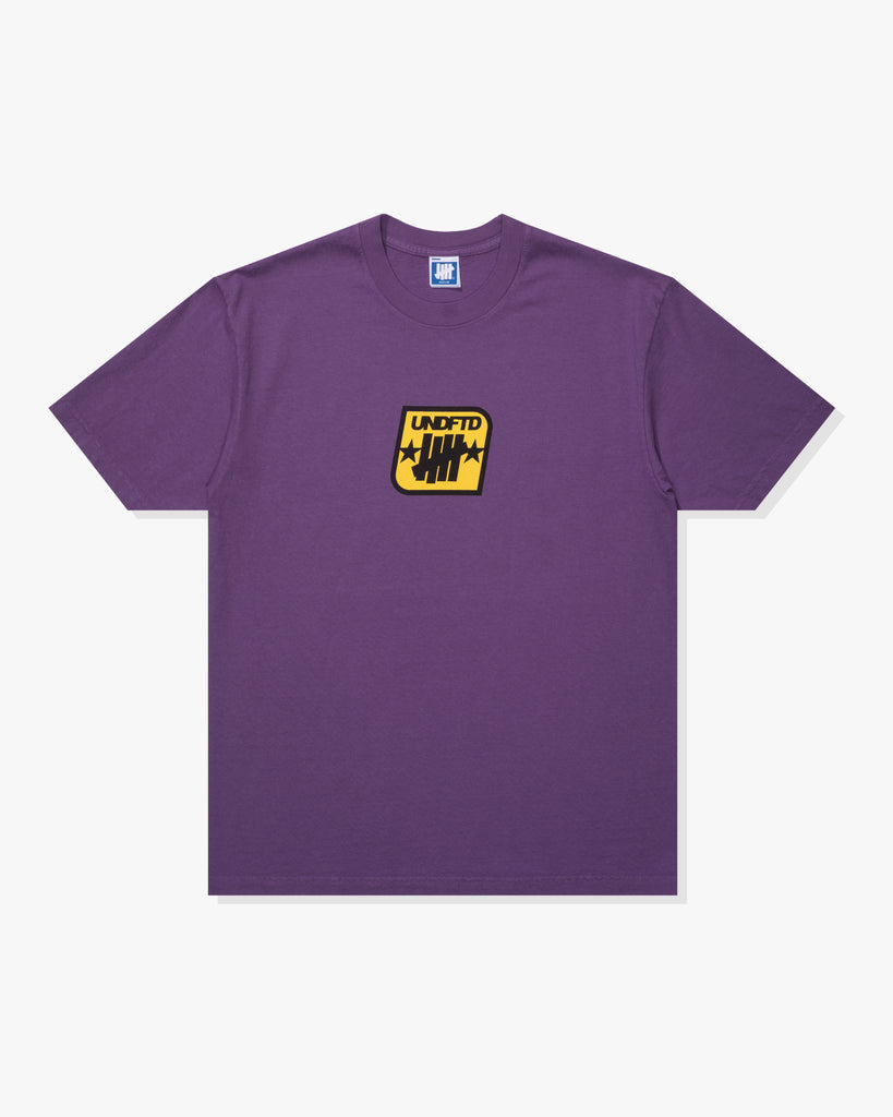 SU26 UNDEFEATED BADGE S/S TEE - PURPLE