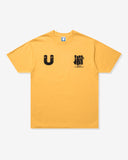 UNDEFEATED COMM S/S TEE MARIGOLD