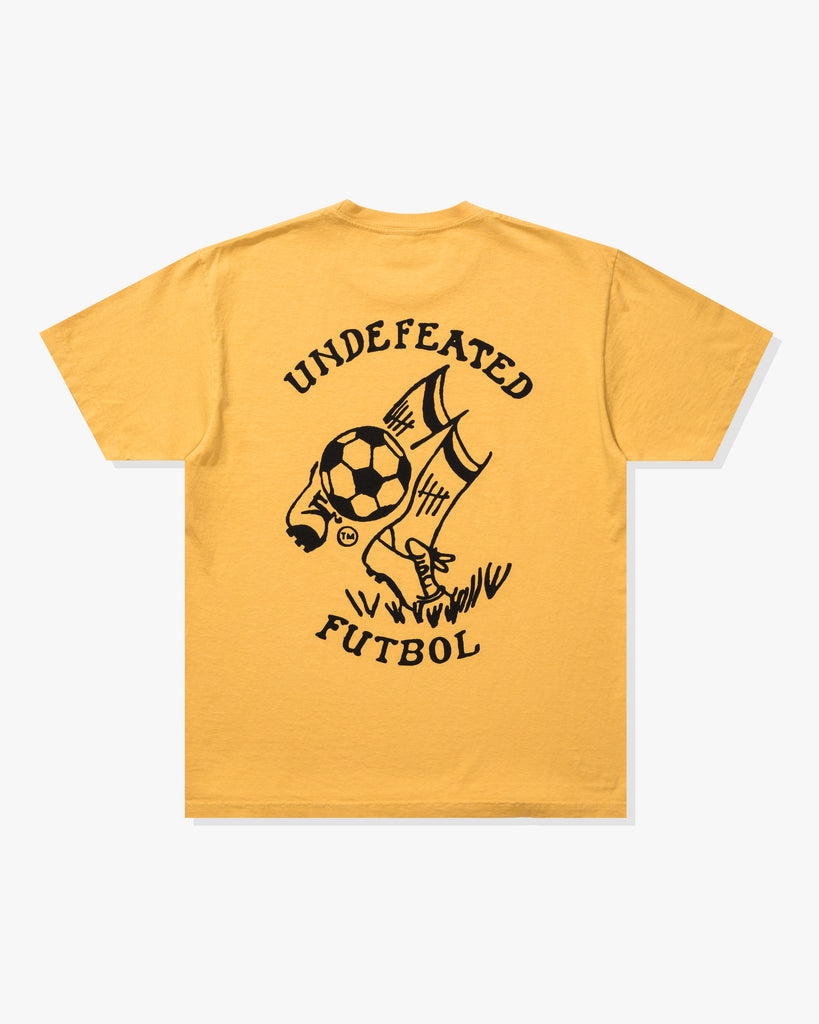 UNDEFEATED FUTBOL S/S TEE MARIGOLD
