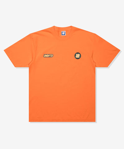 UNDEFEATED SP26 SERIES S/S TEE-ORANGE