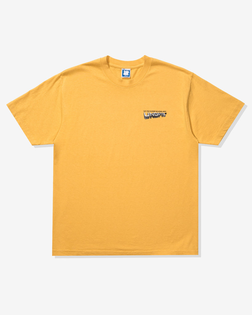UNDEFEATED TEAM STORE S/S TEE MARIGOLD