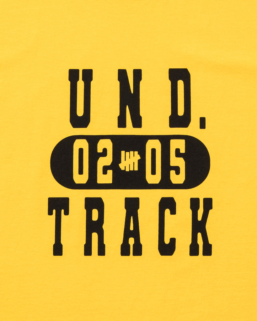 UNDEFEATED TRACK S/S TEE GOLD