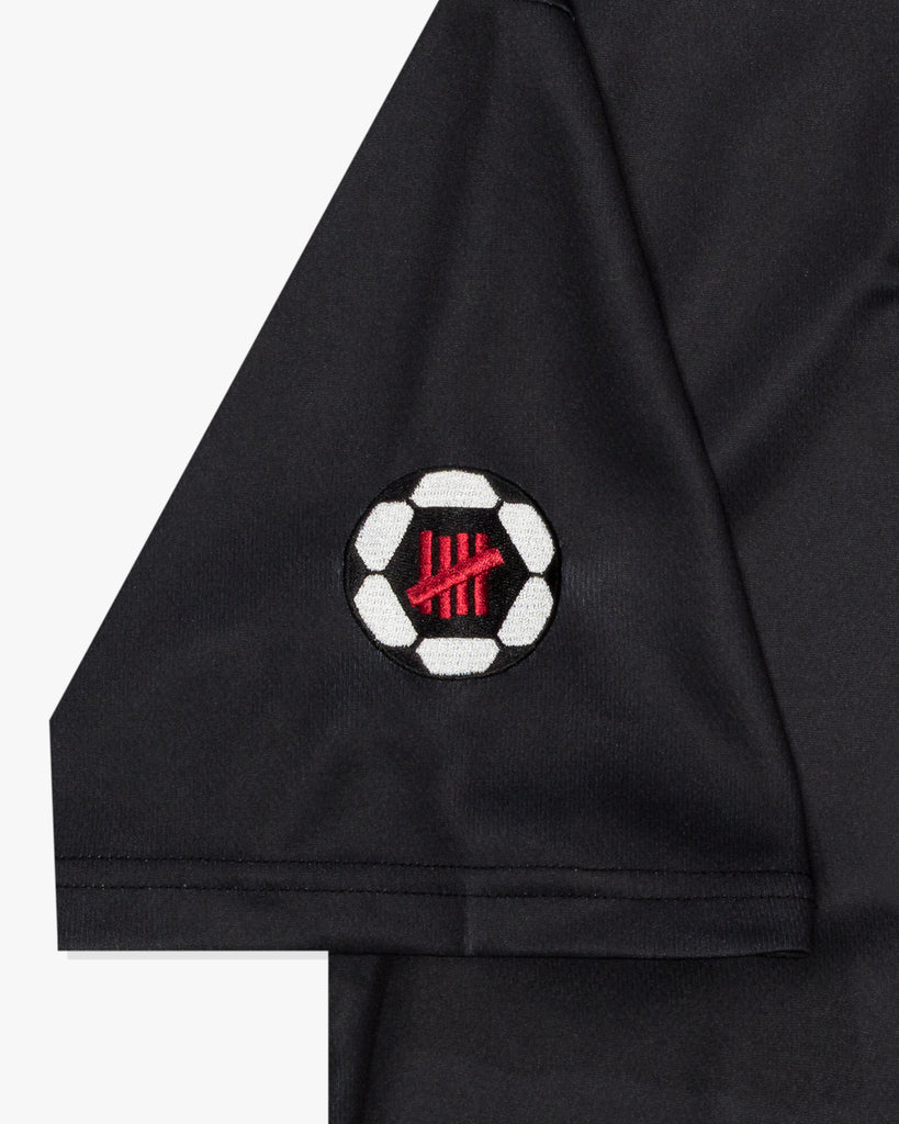 UNDEFEATED SP26 ICON SOCCER JERSEY - BLACK