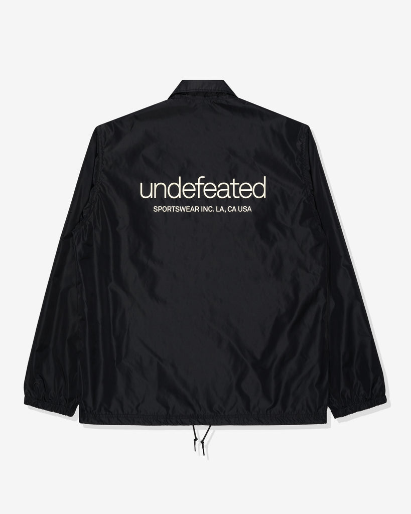 UNDEFEATED SP26 INC. COACHES JACKET - BLACK