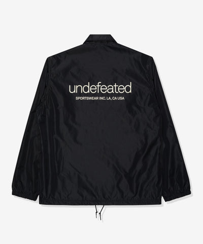 UNDEFEATED SP26 INC. COACHES JACKET - BLACK