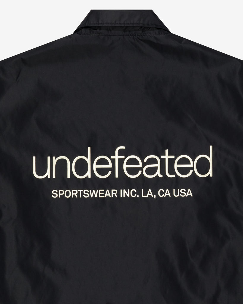 UNDEFEATED SP26 INC. COACHES JACKET - BLACK