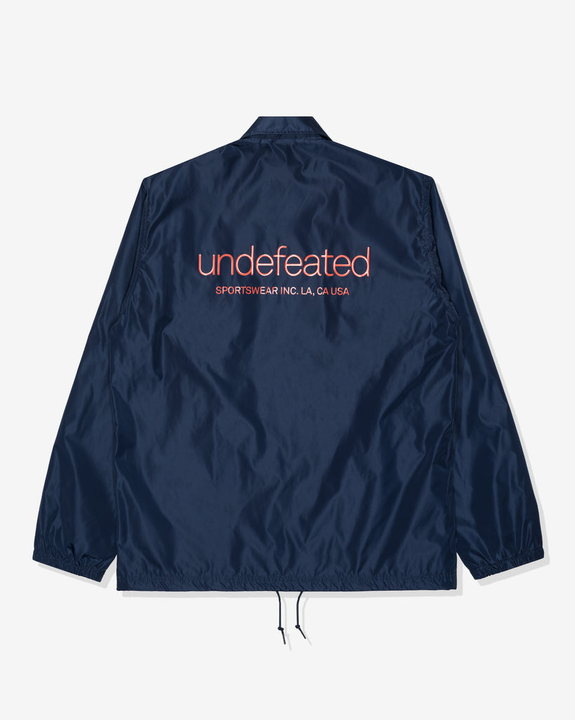 UNDEFEATED SP26 INC. COACHES JACKET - NAVY