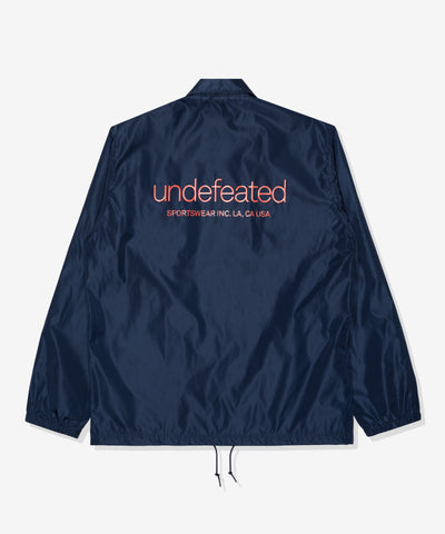 UNDEFEATED SP26 INC. COACHES JACKET - NAVY
