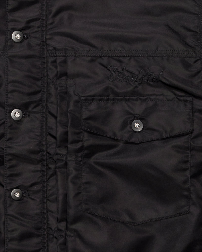 FA26 UNDEFEATED REVERSIBLE TRUCKER JACKET - BLACK