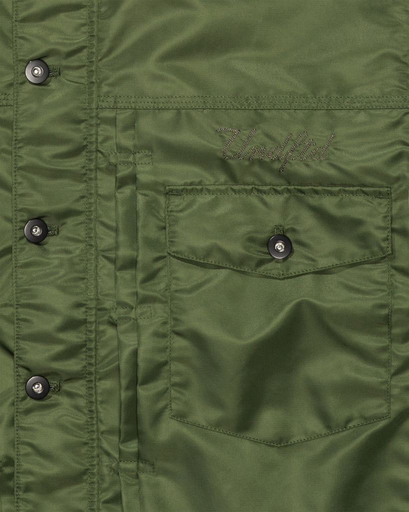 FA26 UNDEFEATED REVERSIBLE TRUCKER JACKET - OLIVE