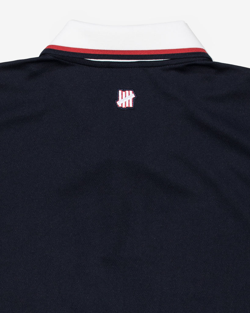 UNDEFEATED SP26 S/S ATHLETIC POLO - NAVY
