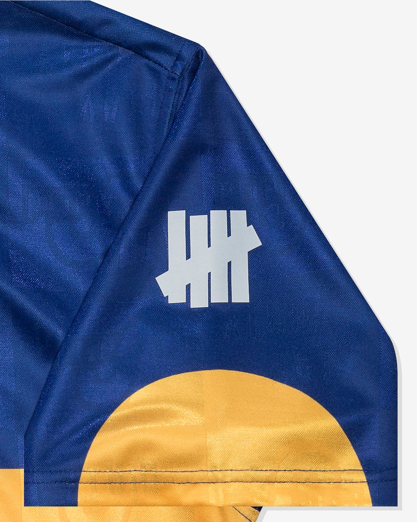 UNDEFEATED SU26 S/S SOCCER POLO - DARK BLUE