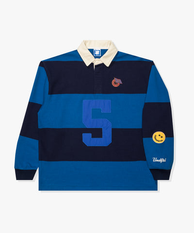 FA26 UNDEFEATED STRIPED L/S RUGBY - BLUE