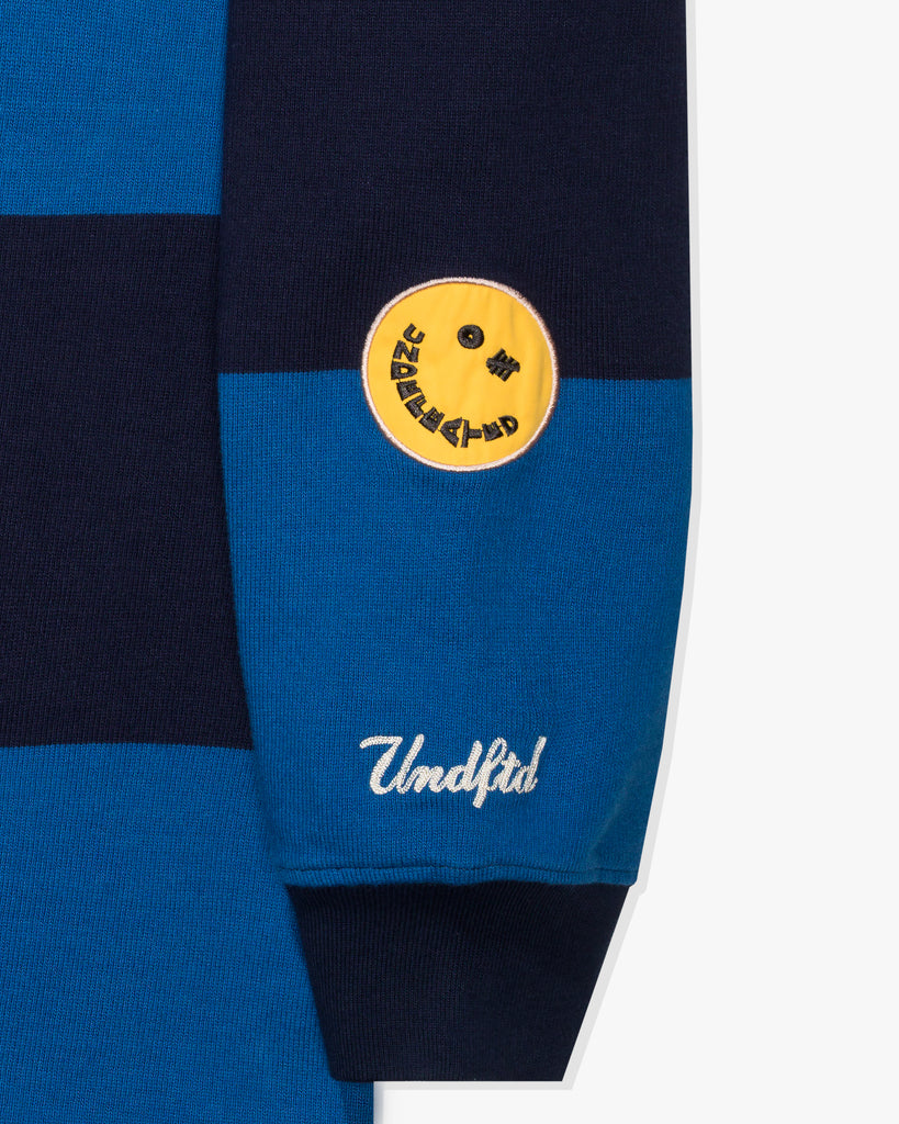 FA26 UNDEFEATED STRIPED L/S RUGBY - BLUE